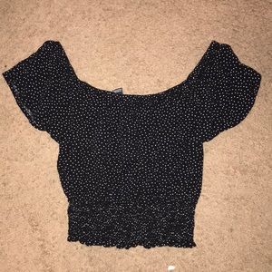 A forever 21 off shoulder black shirt with white polka dots. Medium size